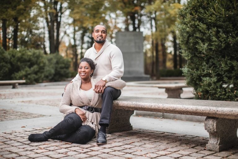 A couple sitting on a bench in Arlington Park.