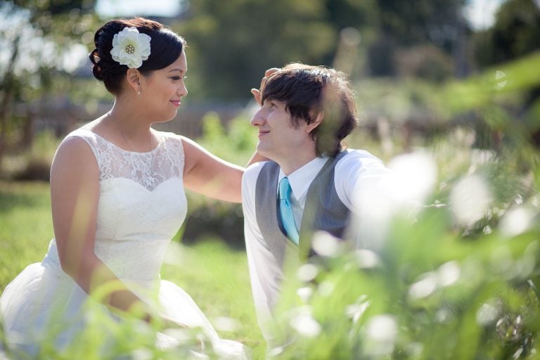 A bride and groom sitting at Vandiver Inn in Havre de Grace, Maryland.