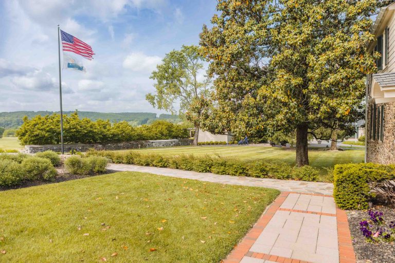 A home in Hunt Valley with an American flag in the front yard.