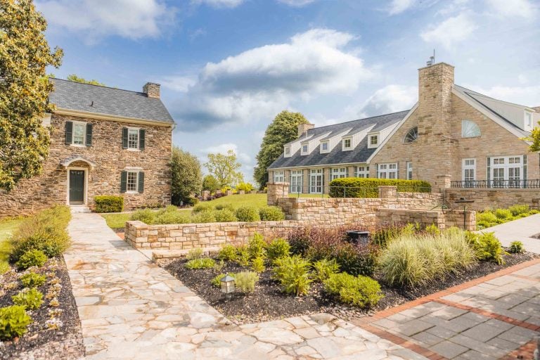 A stone house with a stone walkway in Hunt Valley.