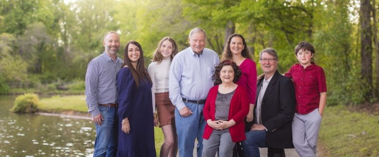 A family posing at Mill Branch Pond in Bowie, Maryland.