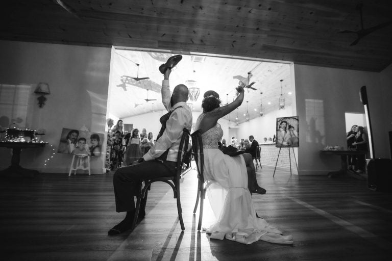 A bride and groom sitting on chairs at Two Lions Vineyard in Upper Marlboro, Maryland.