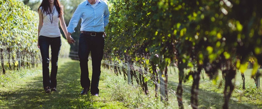 A couple walking through Boordy Vineyards in Maryland.