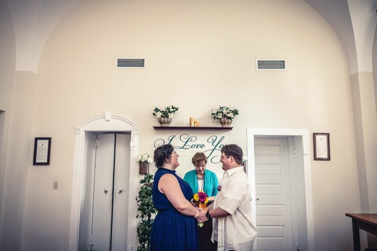 A bride and groom exchange vows in a church in Annapolis.