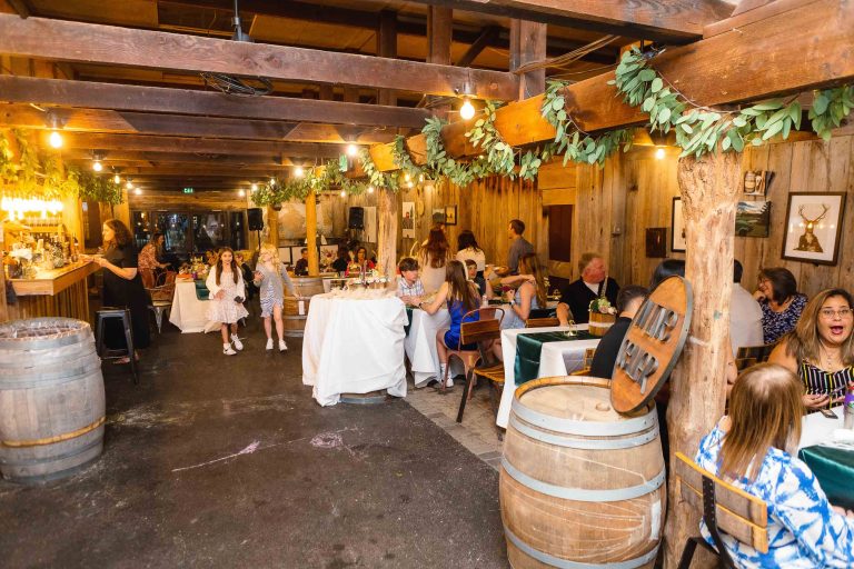 A group of people sitting at tables in a wine cellar in Annapolis, Maryland.