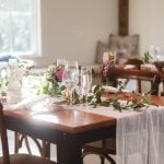 A wedding reception table set up with attention to detail at Fleetwood Farm Winery.