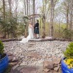 A wedding ceremony in a wooded area.