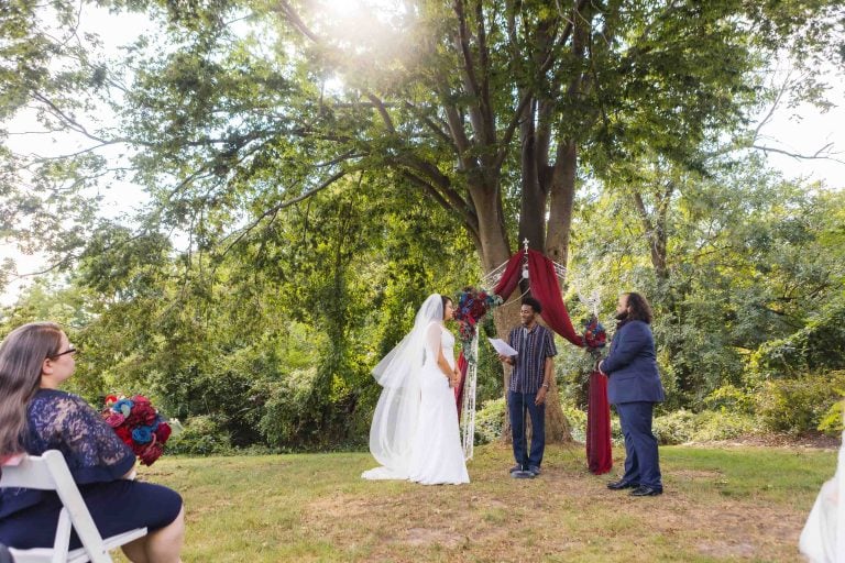 A wedding ceremony under a tree.