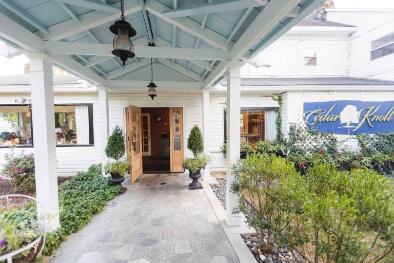 The entrance to a house with a blue door, suitable for wedding portraits.