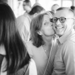 A black and white photo of a couple at a birthday party.