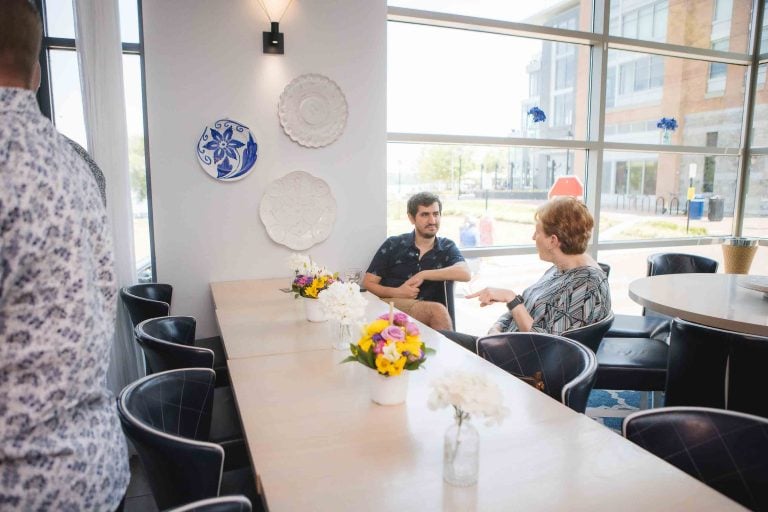 A group of people sitting around a table at Hummingbird Bar & Kitchen in Alexandria, Virginia.