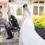 A candid bride and groom during wedding preparation.