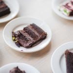 A slice of chocolate cake at a Birthday Party.