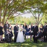 A wedding portrait in front of a tree.