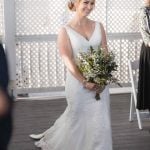 A bride walking down the aisle during a wedding ceremony.