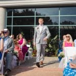 A man participating in a wedding ceremony.