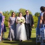 A wedding ceremony at a golf course.