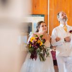 A bride walks down the aisle during her wedding ceremony.