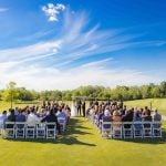 A wedding ceremony at a golf course.