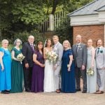 A wedding party poses for a portrait.