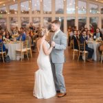 A couple sharing their first dance at their wedding reception.