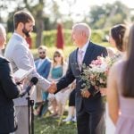 A bride and groom exchange vows during a wedding ceremony.