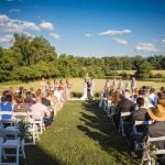 A ceremony in a field for a wedding.