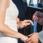 A couple participates in a wedding ceremony.