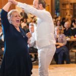 A couple dancing at a wedding reception.