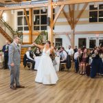 A couple sharing their first dance at their wedding reception.