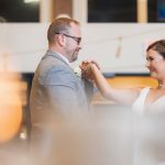 A couple sharing their first dance at a wedding reception.