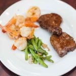 Wedding details: Steak, shrimp, and green beans elegantly plated.