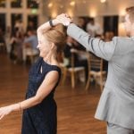 A couple dancing at a wedding reception.