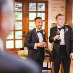 Two grooms at a wedding ceremony.