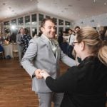 A couple dancing at a wedding reception.