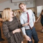 A group dancing at a wedding reception.