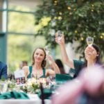 A group celebrating at a wedding reception.