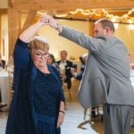 A couple dancing at a wedding reception.