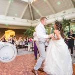 A couple dancing at a wedding reception.