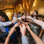 A wedding reception celebration with toasting.