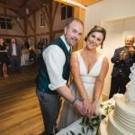 A bride and groom celebrating their wedding reception.