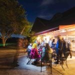 A wedding reception at a restaurant at night.