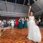 A bride is dancing at a wedding reception.