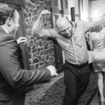 A group dancing at a wedding reception.