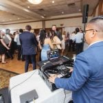 A DJ performing at a wedding reception.