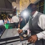 A DJ performing at a wedding reception.