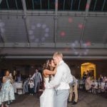 A couple's first dance occurs at their wedding reception.