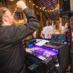 A DJ performing at a wedding reception.