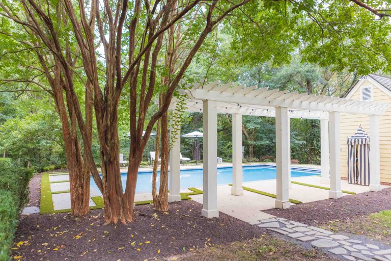 A Pleasant Hill House featuring a backyard with a pool and a pergola, perfect for hosting weddings.