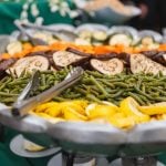 A Savage Mill wedding with a buffet of vegetables and green beans incorporated into the intricate details.